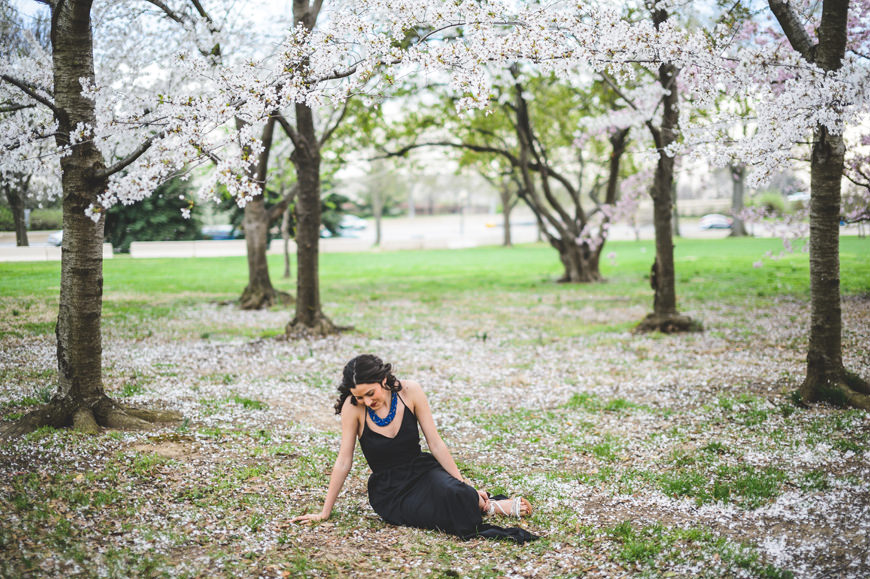 001 girl sitting in cherry blossoms washington DC