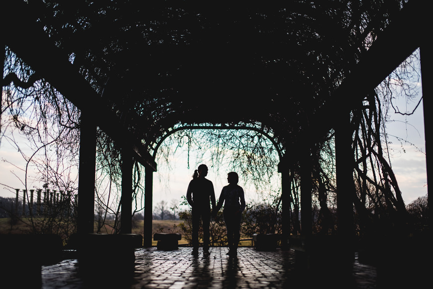 003 silhouette of couple under ivy awning