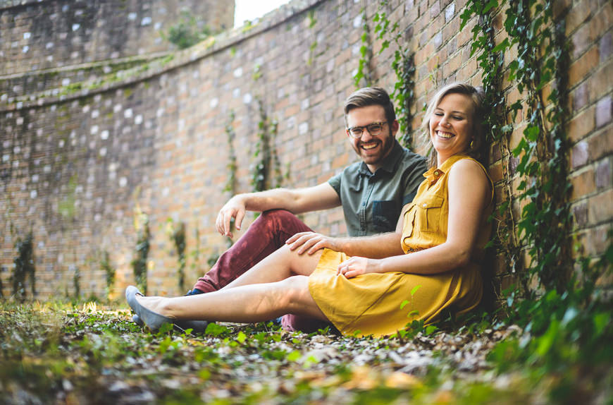004 couple sitting in ivy brick wall