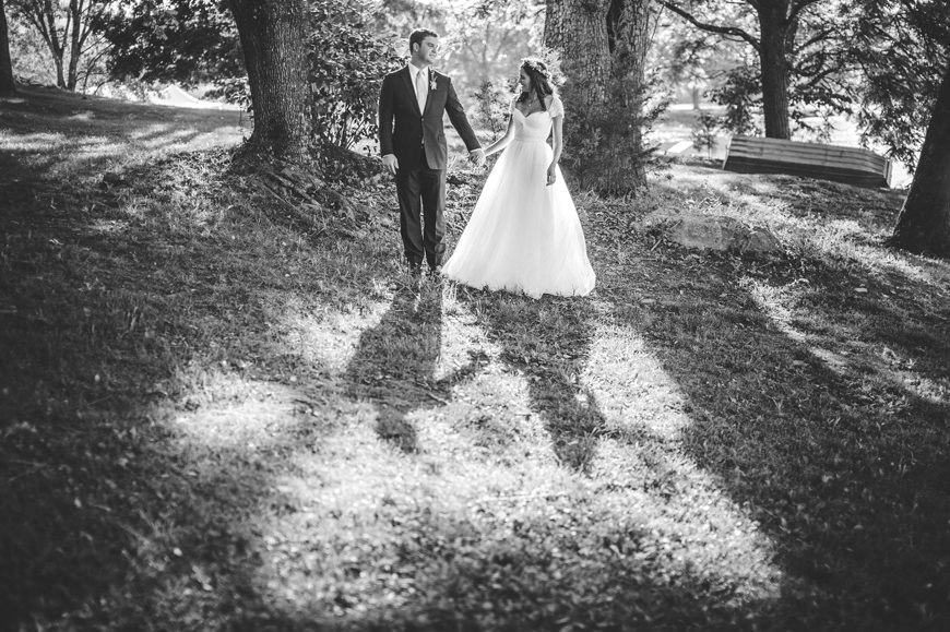 006 black and white portrait of bride and groom in grove of trees
