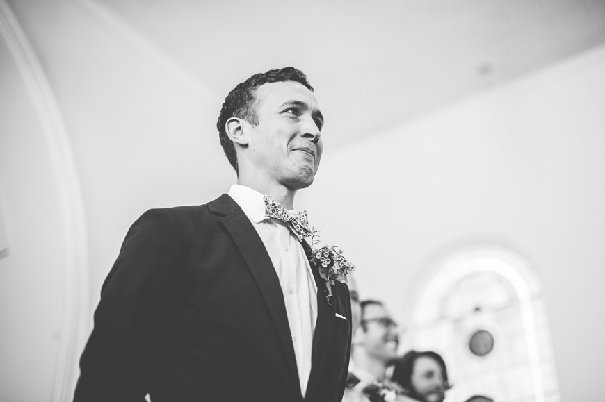 006 groom reacts to bride walking down the aisle