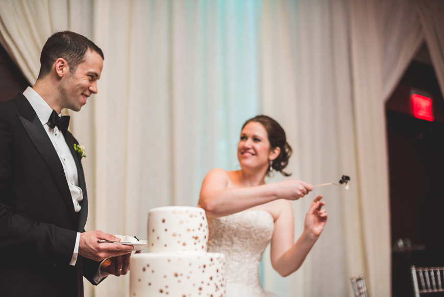 008 bride throwing cake at groom