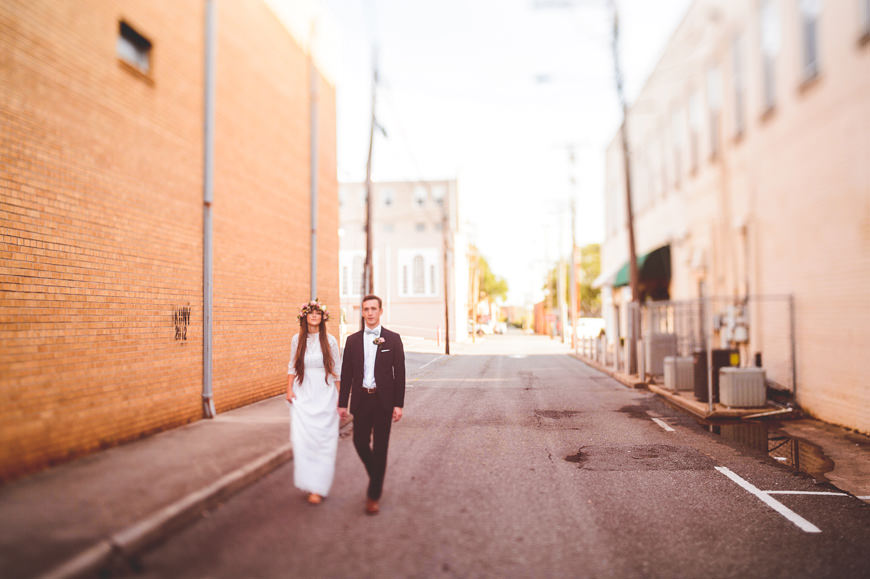 013 freelens as bride and groom walk through alley