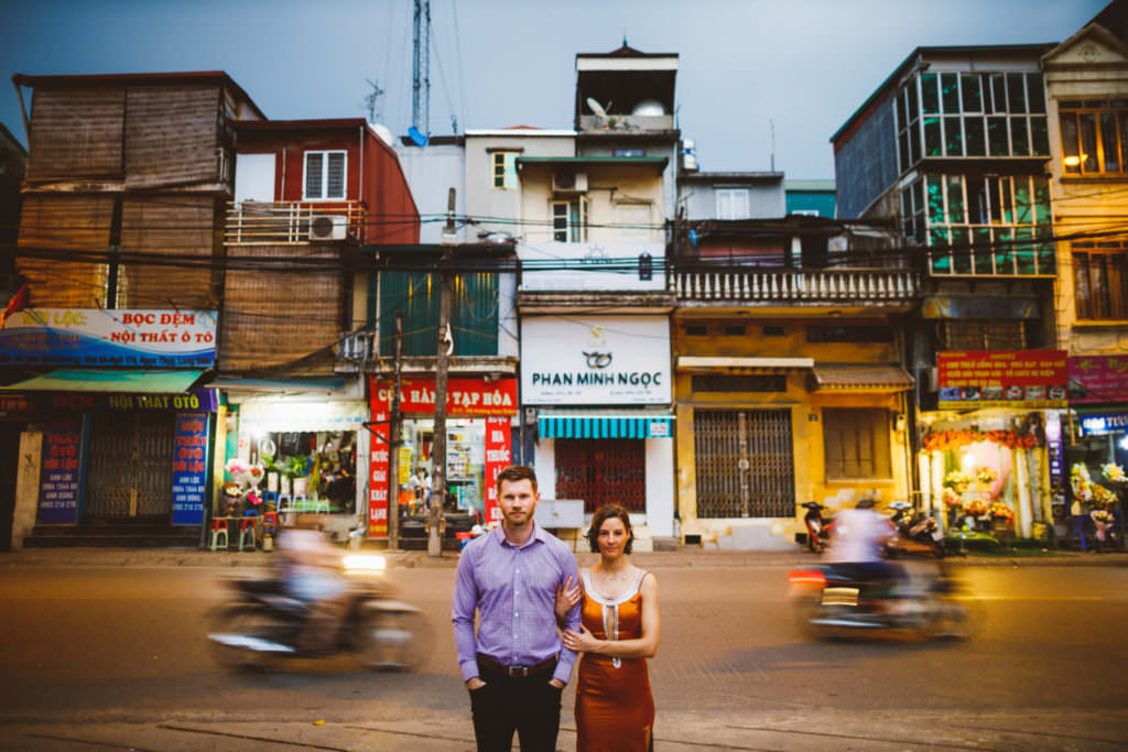 engagement session in vietnam with motorcycles in background