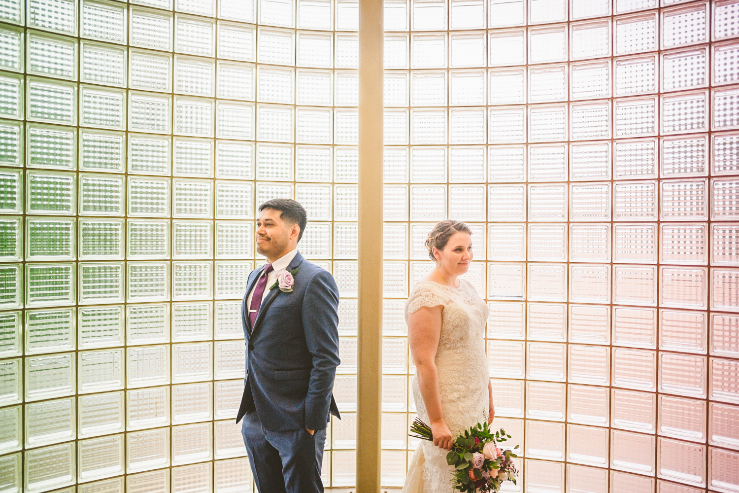 creative portrait of bride and groom with pink and green colors